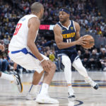 
              Denver Nuggets forward Bruce Brown, right, looks to pass the ball as Los Angeles Clippers forward Nicolas Batum defends in the first half of an NBA basketball game Sunday, Feb. 26, 2023, in Denver. (AP Photo/David Zalubowski)
            
