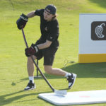 
              Arizona Coyotes forward Clayton Kellar hits his first shot with a hockey stick during a golf skills competition, Wednesday, Feb. 1, 2023, in Plantation, Fla. The event was part of the NHL All Star weekend. (AP Photo/Marta Lavandier)
            