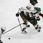 
              Los Angeles Kings left wing Kevin Fiala (22) and Minnesota Wild right wing Mats Zuccarello (36) battle for control of the puck during the third period of an NHL hockey game Tuesday, Feb. 21, 2023, in St. Paul, Minn. Minnesota won 2-1. (AP Photo/Craig Lassig)
            