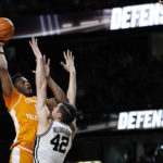 
              Tennessee forward Tobe Awaka shoots over Vanderbilt forward Quentin Millora-Brown (42) during the second half of an NCAA college basketball game Wednesday, Feb. 8, 2023, in Nashville, Tenn. (AP Photo/Wade Payne)
            