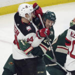 
              Minnesota Wild's Jonas Brodin (25) blocks New Jersey Devils' Nathan Bastian (14) as he sets up by the net during the first period of an NHL hockey game, Saturday, Feb. 11, 2023, in St. Paul, Minn. (AP Photo/Jim Mone)
            