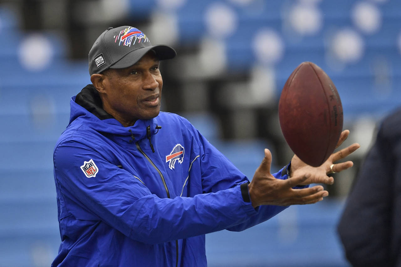 FILE - Buffalo Bills defensive assistant Leslie Frazier catches a ball before an NFL football game ...