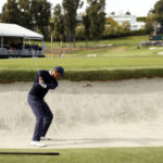 
              Tiger Woods hits from a bunker to the 10th green during the first round of the Genesis Invitational golf tournament at Riviera Country Club, Thursday, Feb. 16, 2023, in the Pacific Palisades area of Los Angeles. (AP Photo/Ryan Kang)
            