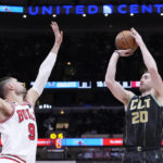 
              Charlotte Hornets' Gordon Hayward shoots as Chicago Bulls' Nikola Vucevic defends during the first half of an NBA basketball game, Thursday, Feb. 2, 2023, in Chicago. (AP Photo/Charles Rex Arbogast)
            