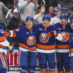 
              New York Islanders center Bo Horvat (14) celebrates with teammates Sebastian Aho (25),Mathew Barzal (13), Noah Dobson (8) and Josh Bailey (12) after scoring a goal during the second period of an NHL hockey game against the Seattle Kraken, Tuesday, Feb. 7, 2023, in Elmont, N.Y. (AP Photo/Frank Franklin II)
            