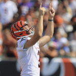 
              FILE - Cincinnati Bengals kicker Evan McPherson (2) points skyward after making a field goal from over 50 yards against the Minnesota Vikings during the second half of an NFL football game, Sunday, Sept. 12, 2021, in Cincinnati. While its Super Bowl commercial appearances are few, religion – Christianity especially – is entrenched in football culture.(AP Photo/Aaron Doster, File)
            