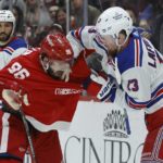 
              Detroit Red Wings defenseman Jake Walman (96) and New York Rangers left wing Alexis Lafrenière (13) fight during the third period of an NHL hockey game Thursday, Feb. 23, 2023, in Detroit. (AP Photo/Duane Burleson)
            