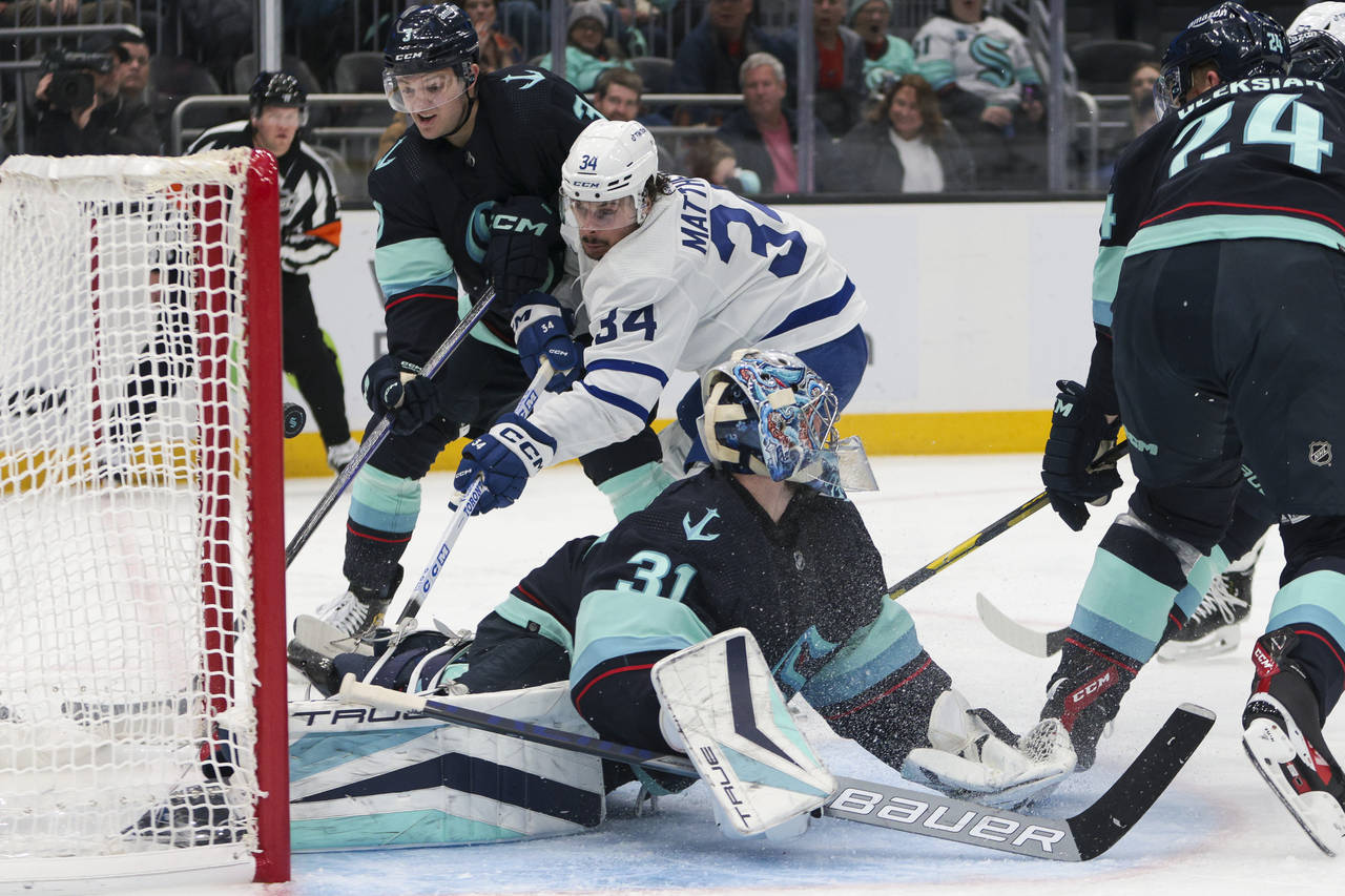 Toronto Maple Leafs center Auston Matthews (34) scores a goal as Seattle Kraken goaltender Philipp ...