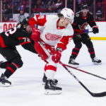 
              Detroit Red Wings left wing Tyler Bertuzzi (59) skates with the puck toward the net as Ottawa Senators defenseman Thomas Chabot (72) tries to push him off it during first-period NHL hockey game action in Ottawa, Ontario, Monday, Feb. 27, 2023. (Sean Kilpatrick/The Canadian Press via AP)
            