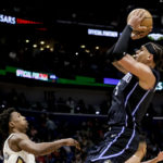 
              Orlando Magic forward Paolo Banchero (5) shoots over New Orleans Pelicans guard Josh Richardson, left, in the second half of an NBA basketball game in New Orleans, Monday, Feb. 27, 2023. (AP Photo/Derick Hingle)
            