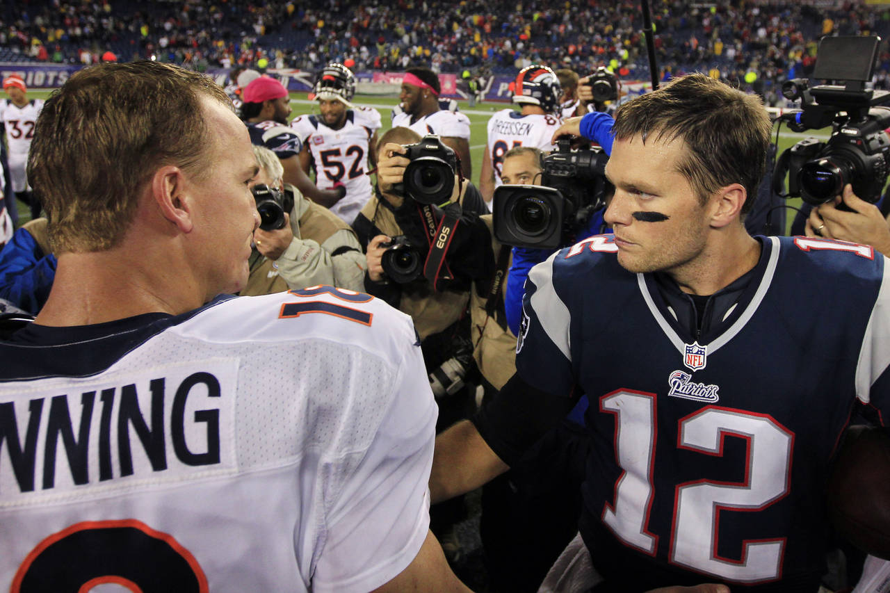 FILE - Denver Broncos quarterback Peyton Manning, left, and New England Patriots quarterback Tom Br...
