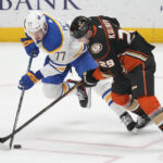 
              Buffalo Sabres right wing JJ Peterka (77) and Anaheim Ducks defenseman Dmitry Kulikov (29) vie for the puck during the first period of an NHL hockey game in Anaheim, Calif., Wednesday, Feb. 15, 2023. (AP Photo/Ashley Landis)
            