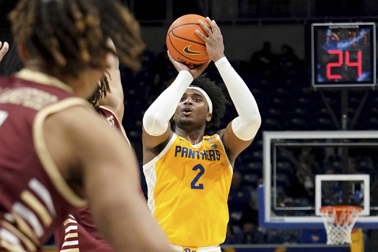Pittsburgh forward Blake Hinson puts up a shot against Boston College during the second half of an ...