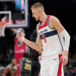 
              Washington Wizards center Kristaps Porzingis reacts after scoring against the Charlotte Hornets during the second half of an NBA basketball game Wednesday, Feb. 8, 2023, in Washington. (AP Photo/Jess Rapfogel)
            