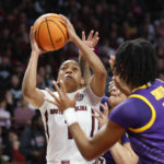 
              South Carolina guard Zia Cooke, left, drives to the basket against LSU forward Sa'Myah Smith (5) during the first half of an NCAA college basketball game in Columbia, S.C., Sunday, Feb. 12, 2023. (AP Photo/Nell Redmond)
            