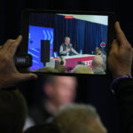 
              A reporter uses an iPad to record as Buffalo Bills general manager Brandon Beane speaks during a press conference at the NFL football scouting combine in Indianapolis, Tuesday, Feb. 28, 2023. (AP Photo/Michael Conroy)
            