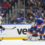 
              Pittsburgh Penguins left wing Jason Zucker (16) scores a goal past New York Islanders goaltender Ilya Sorokin and defenseman Adam Pelech (3) during the second period of an NHL hockey game Friday, Feb. 17, 2023, in Elmont, N.Y. (AP Photo/Mary Altaffer)
            