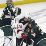 
              Minnesota Wild's Jonas Brodin (25) defends against New Jersey Devils' Nathan Bastian (14) as Brodin assists Wild goalie Filip Gustavsson during the first period of an NHL hockey game Saturday, Feb. 11, 2023, in St. Paul, Minn. (AP Photo/Jim Mone)
            