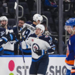 
              Winnipeg Jets' Nikolaj Ehlers (27) celebrates with teammates after scoring a goal as New York Islanders' Kyle Palmieri (21) reacts during the second period of an NHL hockey game Wednesday, Feb. 22, 2023, in Elmont, N.Y. (AP Photo/Frank Franklin II)
            