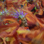 
              A dancer from the Dragoes da Real samba school performs during a carnival parade in Sao Paulo, Brazil, Sunday, Feb. 19, 2023. (AP Photo/Andre Penner)
            