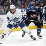 
              Toronto Maple Leafs forward William Nylander, left, controls the puck in front of Columbus Blue Jackets forward Boone Jenner during the first period of an NHL hockey game in Columbus, Ohio, Friday, Feb. 10, 2023. (AP Photo/Paul Vernon)
            