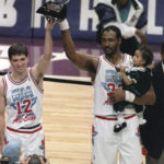 
              FILE - Utah Jazz teammates and co-Most Valuable Player winners John Stockton, left, and Karl Malone hold up the All-Star MVP trophy after playing for the West team, which won the 43rd NBA All-Star game 135-130 in Salt Lake City, on Feb. 21, 1993. Malone holds his daughter, Kaydee. Salt Lake City's hosting of this weekend's NBA All-Star game for the first time in three decades gives Utah another opportunity to reshape a long-held belief that the state is odd or peculiar — a years-long push that Jazz owner Ryan Smith and many other influential state leaders have prioritized.  (AP Photo/Roberto Borea, File)
            