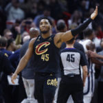 
              Cleveland Cavaliers guard Donovan Mitchell waves to the crowd after fighting with Memphis Grizzlies forward Dillon Brooks during the second half of an NBA basketball game, Thursday, Feb. 2, 2023, in Cleveland. Mitchell and Brooks were ejected from the game. (AP Photo/Ron Schwane)
            