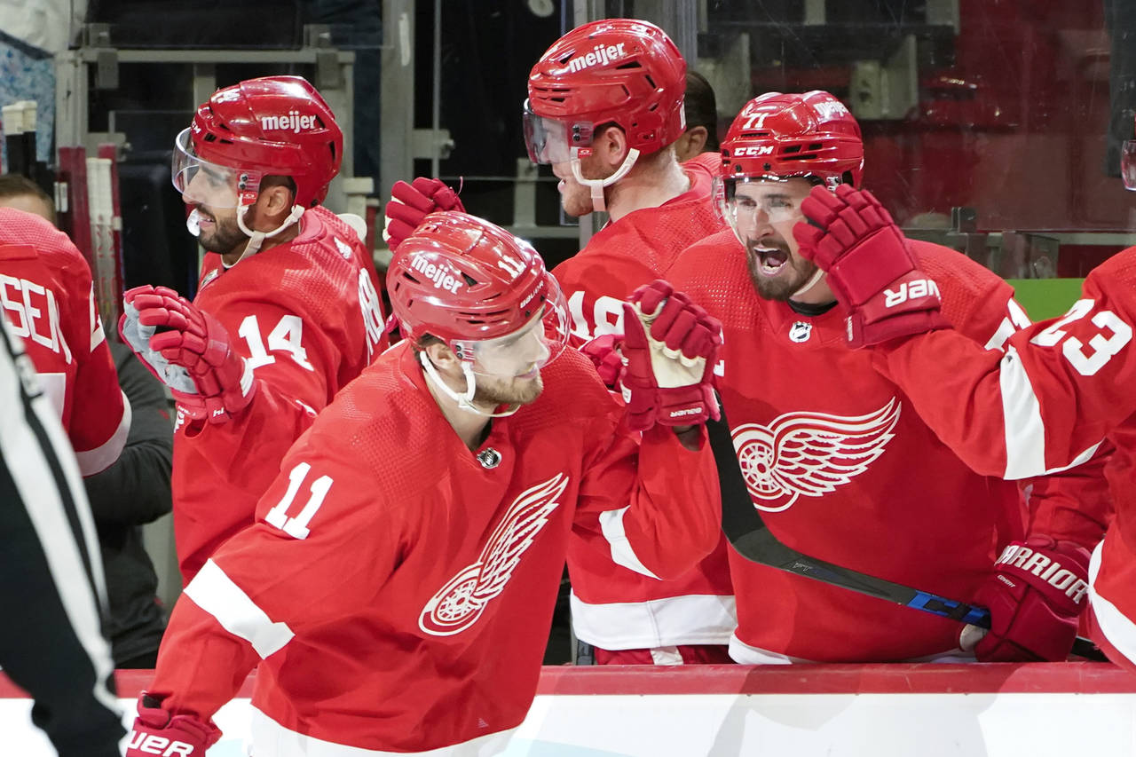 Detroit Red Wings right wing Filip Zadina (11) celebrates his goal against the Calgary Flames in th...