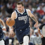
              Dallas Mavericks guard Luka Doncic pursues a loose ball in the first half of an NBA basketball game against the Denver Nuggets Wednesday, Feb. 15, 2023, in Denver. (AP Photo/David Zalubowski)
            