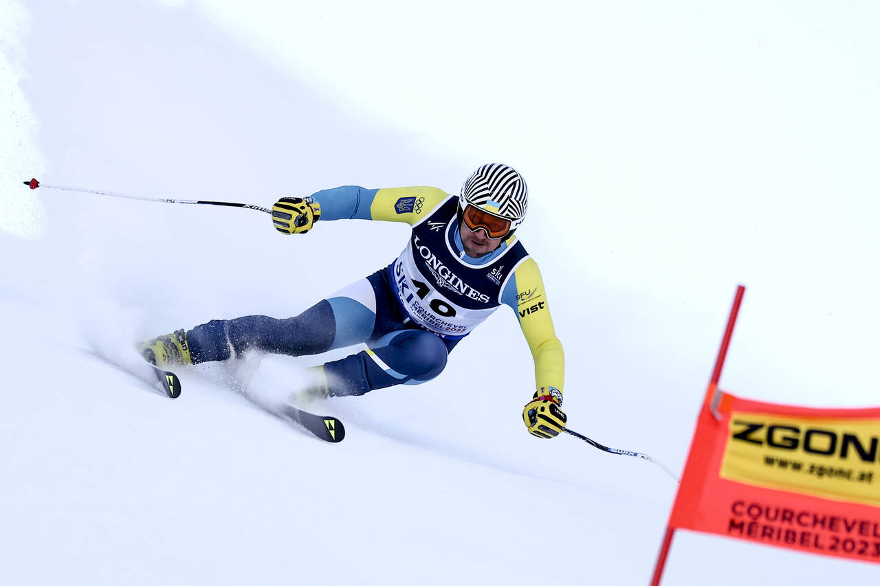 Ukraine's Ivan Kovbasnyuk speeds down the course during the super G portion of an alpine ski, men's...