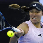 
              FILE - Jessica Pegula, of the U.S., plays a forehand shot during a fourth round match at the Australian Open tennis tournament, in Melbourne, Australia, on Jan. 22, 2023. She has revealed that her mother, Buffalo Bills and Sabres co-owner Kim Pegula, went into cardiac arrest in June and is "improving every day" as she deals with significant language and memory issues. (AP Photo/Ng Han Guan, File)
            