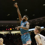 
              New Mexico Morris Udeze shoots and scores during the first half of an NCAA college basketball game against Air Force in Albuquerque, N.M., Friday, Jan. 27, 2023. New Mexico won 83-71. (AP Photo/Eric Draper)
            