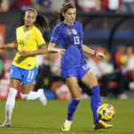 
              United States forward Alex Morgan (13) controls the ball in front of Brazil midfielder Adriana (11) during the first half of a SheBelieves Cup soccer match Wednesday, Feb. 22, 2023, in Frisco, Texas. (AP Photo/LM Otero)
            