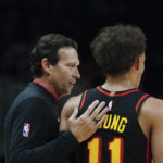 
              Newly hired Atlanta Hawks teach coach Quin Snyder talks with guard Trae Young (11) during the first half of an NBA basketball game against the Washington Wizards Tuesday, Feb. 28, 2023, in Atlanta. (AP Photo/John Bazemore)
            