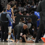 
              A scrum breaks out between Minnesota Timberwolves and Orlando Magic players during the second half of an NBA basketball game, Friday, Feb. 3, 2023, in Minneapolis. (AP Photo/Abbie Parr)
            