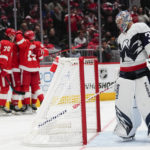 
              Washington Capitals goaltender Darcy Kuemper, right, looks on as Detroit Red Wings players celebrate a goal by Pius Suter during the third period of an NHL hockey game, Tuesday, Feb. 21, 2023, in Washington. The Red Wigs won 3-1. (AP Photo/Julio Cortez)
            