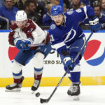 
              Tampa Bay Lightning defenseman Erik Cernak (81) and Colorado Avalanche right wing Valeri Nichushkin (13) chase a loose puck during the first period of an NHL hockey game Thursday, Feb. 9, 2023, in Tampa, Fla. (AP Photo/Chris O'Meara)
            