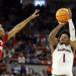 
              Auburn guard Wendell Green Jr. (1) shoots a three pointer as Alabama guard Rylan Griffen (3) defends during the second half of an NCAA college basketball game, Saturday, Feb. 11, 2023, in Auburn, Ala. (AP Photo/Butch Dill)
            