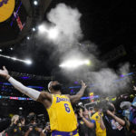
              Los Angeles Lakers forward LeBron James tosses powder in the air prior to the team's NBA basketball game against the Oklahoma City Thunder on Tuesday, Feb. 7, 2023, in Los Angeles. (AP Photo/Ashley Landis)
            