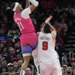 
              Washington Wizards center Daniel Gafford, left, shoots over Chicago Bulls center Nikola Vucevic during the first half of an NBA basketball game in Chicago, Sunday, Feb. 26, 2023. (AP Photo/Nam Y. Huh)
            