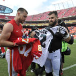 
              FILE - Kansas City Chiefs tight end Travis Kelce, left, and his brother, Philadelphia Eagles center Jason Kelce (62) prepare to exchange jerseys following an NFL football game in Kansas City, Mo., on Sept. 17, 2017.  For the first time in Super Bowl history, a pair of siblings will square off on the NFL’s grandest stage. (AP Photo/Ed Zurga, File)
            