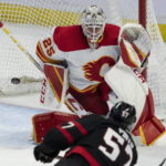 
              Ottawa Senators center Shane Pinto fires the puck wide of Calgary Flames goaltender Jacob Markstrom during second-period NHL hockey game action Monday, Feb. 13, 2023, in Ottawa, Ontario. (Adrian Wyld/The Canadian Press via AP)
            