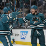 
              San Jose Sharks left wing Evgeny Svechnikov, right, is congratulated by center Nico Sturm (7) after scoring against the Seattle Kraken during the second period of an NHL hockey game in San Jose, Calif., Monday, Feb. 20, 2023. (AP Photo/Jeff Chiu)
            
