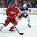 
              Edmonton Oilers left wing Zach Hyman (18) defends Detroit Red Wings defenseman Jake Walman (96) in the first period of an NHL hockey game Tuesday, Feb. 7, 2023, in Detroit. (AP Photo/Paul Sancya)
            