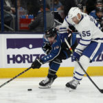 
              Columbus Blue Jackets forward Liam Foudy, left, reaches for the puck next to Toronto Maple Leafs defenseman Mark Giordano during the second period of an NHL hockey game in Columbus, Ohio, Friday, Feb. 10, 2023. (AP Photo/Paul Vernon)
            