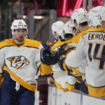 
              Nashville Predators center Yakov Trenin (13) celebrates with teammates after scoring against the Arizona Coyotes in the first period during an NHL hockey game, Sunday, Feb. 26, 2023, in Tempe, Ariz. (AP Photo/Rick Scuteri)
            