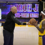 
              Kareem Abdul-Jabbar, left, hands the ball to Los Angeles Lakers forward LeBron James after passing Abdul-Jabbar to become the NBA's all-time leading scorer during the second half of an NBA basketball game against the Oklahoma City Thunder Tuesday, Feb. 7, 2023, in Los Angeles. (AP Photo/Marcio Jose Sanchez)
            