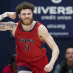 
              Saint Mary's guard Logan Johnson reacts after scoring against BYU during the second half of an NCAA college basketball game in Moraga, Calif., Saturday, Feb. 18, 2023. (AP Photo/Godofredo A. Vásquez)
            