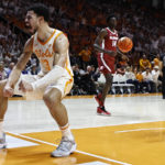 
              Tennessee forward Olivier Nkamhoua (13) reacts to dunking the ball during the first half of an NCAA college basketball game against Alabama, Wednesday, Feb. 15, 2023, in Knoxville, Tenn. (AP Photo/Wade Payne)
            