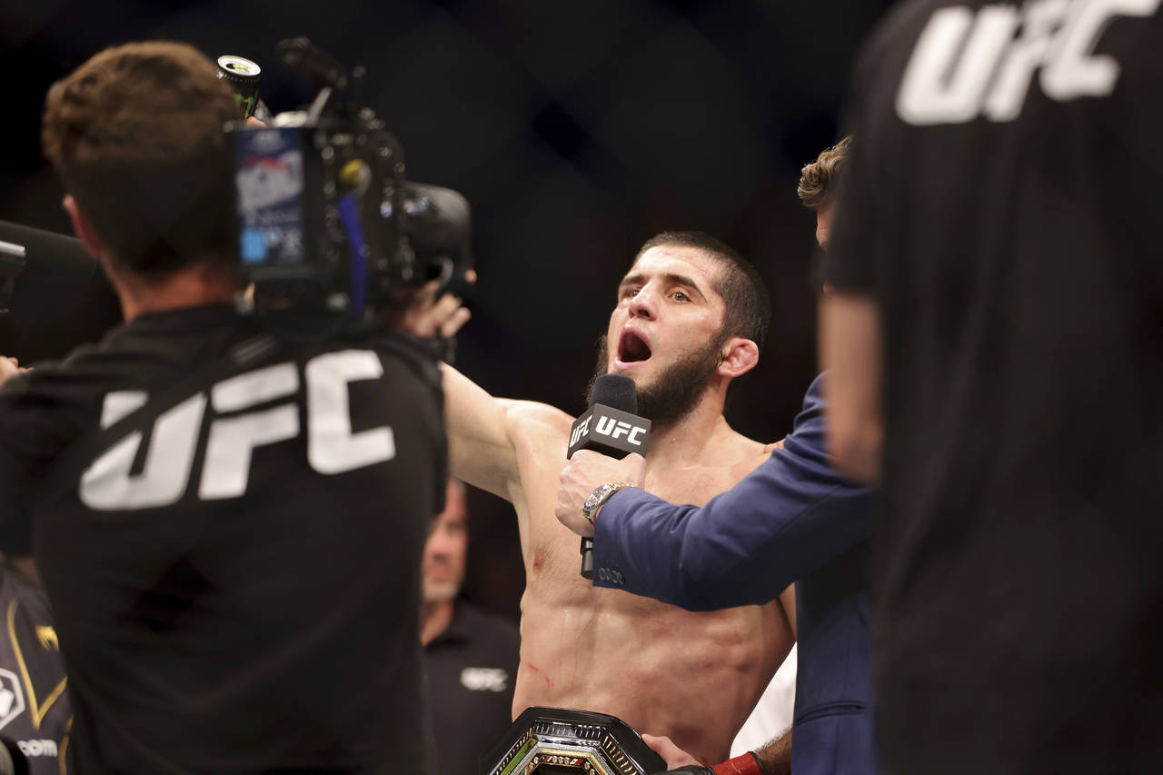 Islam Makhachev of Russia racts after winning his fight against Alex Volkanovski of Australia durin...